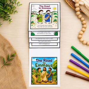 May include: A stack of illustrated cards titled "The Road to Emmaus." The cards depict a biblical story with colorful drawings of people and landscapes. Text on the cards describes the narrative, including the phrase "Two friends were walking."