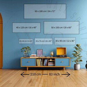 May include: A blue media console with two drawers and open shelving, featuring a record player, a plant, and a guitar nearby. Six rectangular wall art size guides are displayed with dimensions: 60x180 cm (24x72"), 40x120 cm (16x48"), 50x150 cm (20x60"), 20x60 cm (8x24"), 25x75 cm (10x30"), and 30x90 cm (12x36"). A floor measurement of 210 cm or 83 inches is indicated.