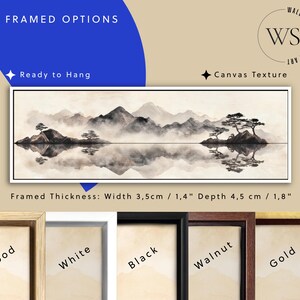 May include: Framed canvas art featuring a serene landscape with mountains, trees, and a reflective body of water. The artwork is in shades of gray and white, with a width of 1.4 inches and a depth of 1.8 inches. The text "FRAMED OPTIONS" is visible.