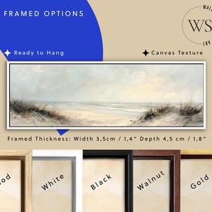 May include: A panoramic framed canvas print featuring a beach landscape with sand dunes, tall grass, and a calm ocean under a soft sky. The frame has a width of 1.4 inches and a depth of 1.8 inches. Available frame finishes include wood, white, black, walnut, and gold.