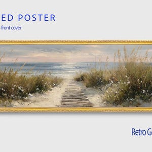 May include: A panoramic framed poster featuring a coastal landscape with a wooden boardwalk leading through sand dunes toward the ocean. The artwork is enclosed in a textured retro gold frame and includes a clear plexiglass front cover for protection.