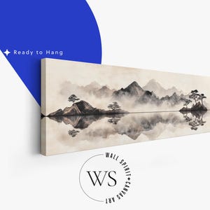 May include: A long, rectangular canvas print featuring a serene landscape with mountains, trees, and a reflective lake. The artwork is in shades of gray and beige, with the text "Ready to Hang" visible. The Wall Spirit Canvas Art logo is also present.