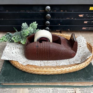 May include: A rustic wooden sign with the text "Welcome to our home" in white lettering. The sign features a distressed finish and a simple, inviting design, perfect for a front porch or entryway.