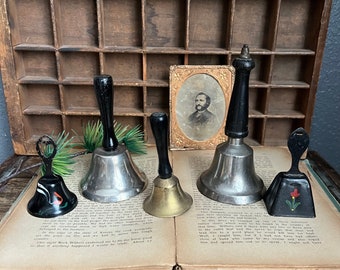 Collection of 5 Vintage Metal Bells Lot Handpainted Jingle Hand Cow Black Gold Wooden Handle Rustic Display Small Teacher Church Chime