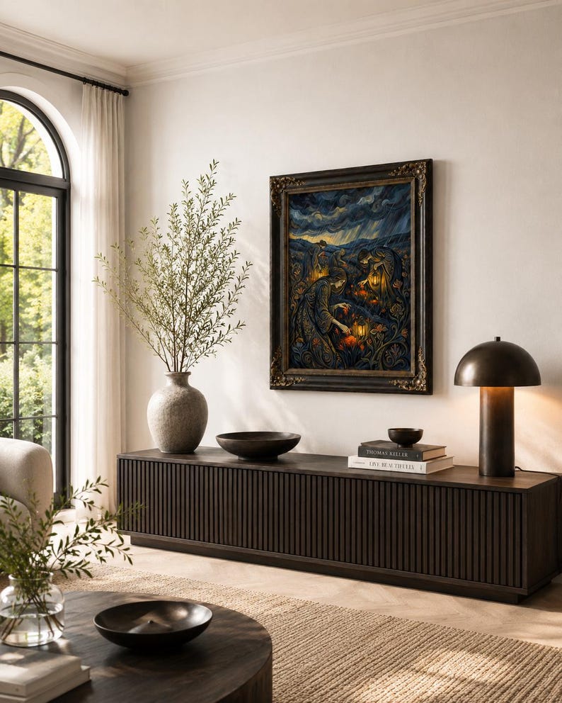 May include: A living room scene featuring a dark wood cabinet with a framed painting, a vase with greenery, and a table lamp. The painting has a dark, ornate frame and depicts a scene with figures and lanterns. A round coffee table and a rug are in the foreground.