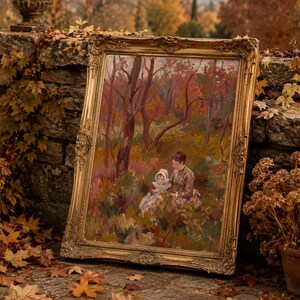 May include: An antique framed painting depicting a woman and child in a forest setting. The artwork features warm tones of red, brown, and green, with a gold ornate frame. The painting is leaning against a stone wall, surrounded by autumn leaves.
