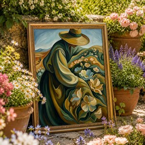 May include: A framed painting with a gold ornate frame depicts a person in a hat and long coat tending to flowers in a field. The artwork features a palette of greens, blues, and yellows. The painting is set outdoors, surrounded by potted flowers.