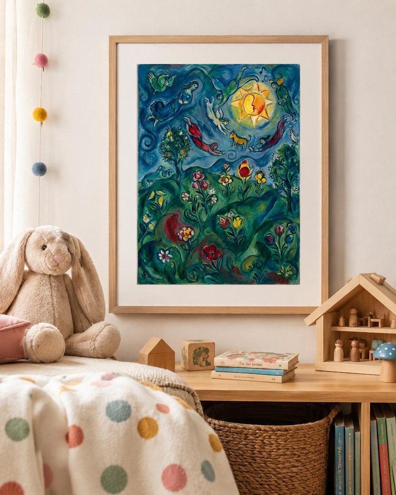 May include: A framed art print with a colourful, whimsical illustration. The artwork features a vibrant sun, figures, and a garden scene with flowers. The print is in a light wood frame, displayed above a child's bed with a plush bunny and decorative items.