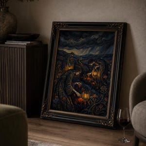 May include: A framed artwork depicting figures in ornate gowns tending to glowing flowers under a stormy sky. The dark, detailed painting is set in a black ornate frame, resting on a wooden floor. A glass of red wine sits nearby, adding a touch of elegance.