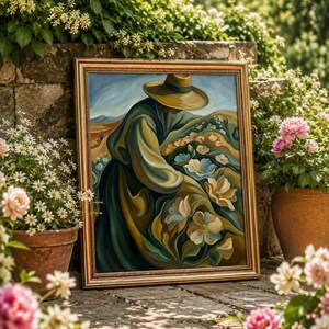 May include: A framed painting with a gold border depicts a figure in a hat and long coat tending to flowers in a field. The artwork features a palette of greens, blues, and yellows. The painting is propped against a stone wall, surrounded by potted flowers.