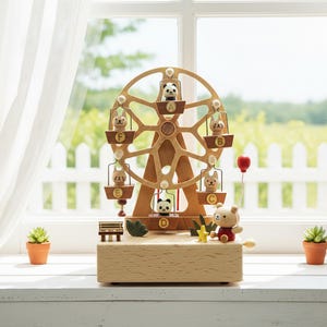 May include: A wooden ferris wheel toy featuring six hanging gondolas, each containing a small animal figure labeled with letters A through F. The base includes a bear figure holding a red balloon, a small bench, and a yellow star, all crafted from light-toned wood.