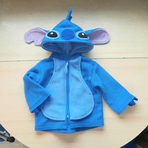 May include: A set of three ceramic mugs with a speckled, matte finish in cream, light grey, and dark grey. Each mug has a simple, minimalist design, ideal for coffee or tea.