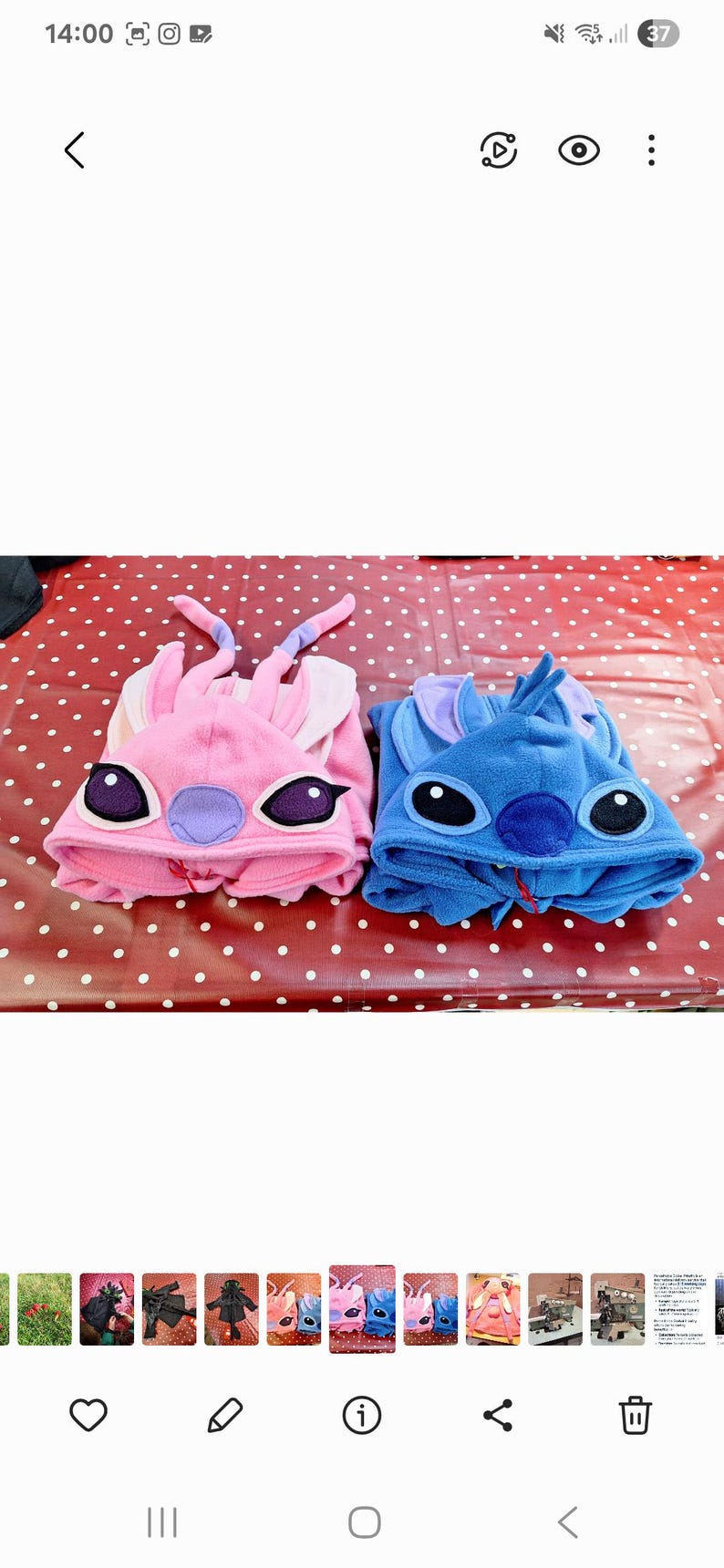 May include: Two character-themed hooded onesie pajamas, one pink and one blue. The pink onesie has a purple nose and ears, while the blue one has a blue nose. These cosy pajamas feature large character eyes and ears, perfect for lounging.