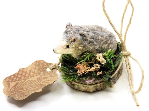 Little Hedgehog is a miniature sculpture, a handcrafted one- of-a-kind piece, mounted on a birchwood slice.