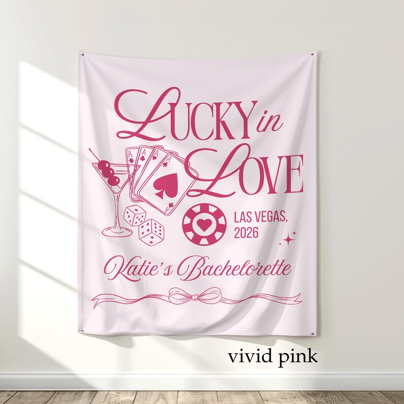 May include: Vivid pink tapestry with the text "Lucky in Love" and "Las Vegas, 2026". The design includes a martini glass, playing cards, dice, and a casino chip. The words "Katie's Bachelorette" are also included.