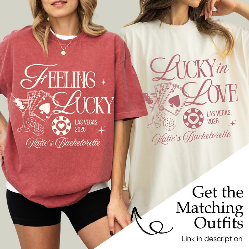 May include: Two t-shirts, one red and one cream, with Las Vegas-themed graphics. The red shirt says "Feeling Lucky" with playing cards, dice, and a casino chip. The cream shirt says "Lucky in Love" with similar imagery. Both shirts are for Katie's Bachelorette in 2026.