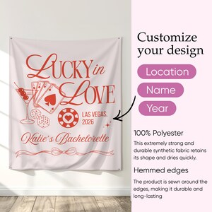 May include: A white polyester wall tapestry with red text and graphics. The design includes the words "Lucky in Love," playing cards, dice, and a casino chip. It reads "Las Vegas, 2026" and "Katie's Bachelorette."