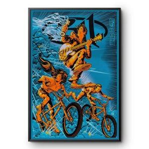 May include: A framed poster featuring a stylized illustration in orange and blue. A person plays an electric guitar above two others riding bicycles. The background shows blue clouds and lightning. Text includes August 19, 2023, and North Island.