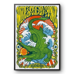 May include: A framed poster featuring a large green alligator rising from blue waves against a red sunburst background. The text WIDESPREAD PANIC appears at the top in yellow, with the text PEOPLE THROUGH MUSIC inside the alligator's mouth.