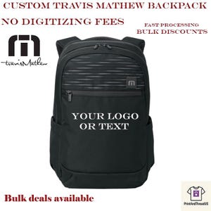 May include: Black Travis Mathew backpack with the text "YOUR LOGO OR TEXT" on the front. The backpack has a striped design on the top section and the Travis Mathew logo on the side. The text "CUSTOM TRAVIS MATHEW BACKPACK" is at the top.