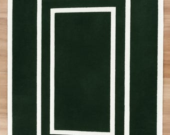 Alfombra geométrica tejida a mano: Alfombra Art Déco en tonos verde oscuro y marfil