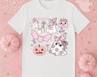 May include: White t-shirt featuring a collection of cute, pastel-colored Halloween-themed illustrations. The design includes ghosts, pumpkins, bats, flowers, and the word "Spooky". The overall aesthetic is soft and whimsical.