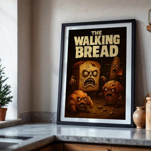 Puede incluir: Impresión artística enmarcada con el texto "THE WALKING BREAD" en dorado. La obra muestra productos de panadería con aspecto de zombis: pan, cruasán, magdalena y baguette. La impresión está en un marco negro, ideal para la cocina.