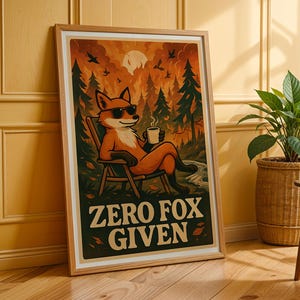 May include: A framed art print featuring a relaxed fox wearing sunglasses, seated in a chair, holding a mug. The artwork has a forest backdrop with the text "ZERO FOX GIVEN" in a bold font. The color palette includes orange, green, and brown.