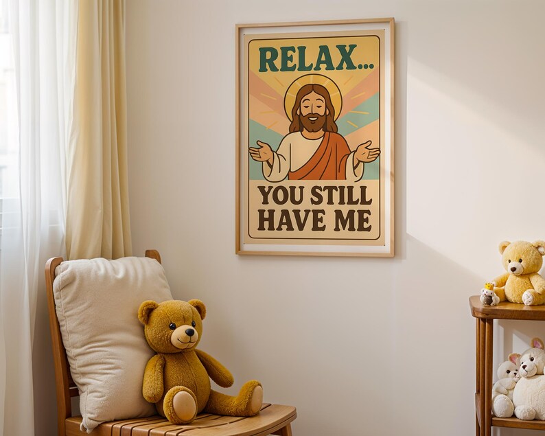 May include: A framed poster with the text "RELAX... YOU STILL HAVE ME" featuring an illustration of Jesus. A teddy bear sits on a wooden chair in front of a white wall. A small wooden shelf holds more teddy bears.