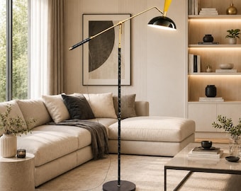 May include: A modern floor lamp with a black marble-patterned pole, a gold-toned arm, and a black lampshade with a yellow accent. The lamp is positioned in a living room with a beige sectional sofa and a marble coffee table.