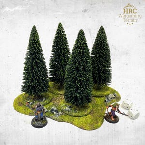 May include: Miniature forest terrain featuring four green pine trees on a grassy base. Includes two miniature figures and two white dice. Designed for tabletop wargaming.