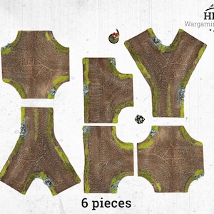 Könnte beinhalten: Sechs-teiliges Wargaming-Geländeset mit braunen Straßenabschnitten, grünen Grasrändern und felsigen Details. Enthält eine Miniaturfigur und einen Würfel. Der Text "6 pieces" ist sichtbar.