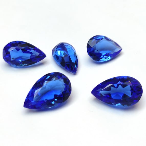 Faceted Dark Blue Topaz Pear Gemstone: 12.55 Carat, 12x15mm