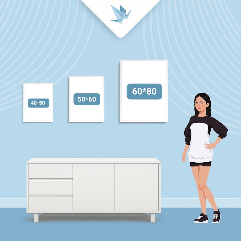 May include: Three framed art prints with dimensions labeled 40x50, 50x60, and 60x80 cm, displayed on a light blue wall. A white cabinet with three drawers and two doors is below the prints. A person is standing next to the cabinet.