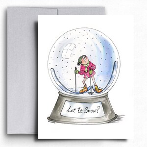 Humorvolle Schneekugel-Weihnachtskarte. Ski Liebhaber Grußkarte. Handgezeichnete Winterszene mit lustigem Gesicht Weihnachtskarte für ihn. Let It Snow Karte.