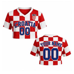 May include: Croatia crop top in red and white checkered pattern. Features the word "CROATIA" and the number "00" in blue. The back of the shirt has the words "YOUR NAME" and the number "00".