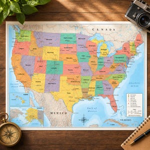 May include: A colorful wall map of the United States of America featuring individual states in various shades of yellow, green, orange, and purple. The map includes labels for states, major cities, highways, and bodies of water, with a legend.