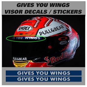 May include: A red, white, and black motorcycle helmet with the text "PULL&BEAR" and "Red Bull" visible. The helmet has a black visor and the text "GIVES YOU WINGS" is displayed above and below the helmet.