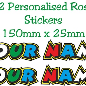 Puede incluir: Dos juegos de pegatinas personalizadas con el texto 'YOUR NAME' en una fuente dentada multicolor con letras rojas, verdes, azules, blancas y naranjas delineadas en negro y amarillo. El texto 'X2 Personalised Rossi Stickers 150mm x 25mm' aparece arriba.