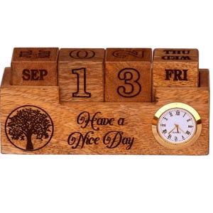 May include: Wooden perpetual calendar with a clock. The calendar displays "SEP 13 FRI" with a tree graphic and the phrase "Have a Nice Day." The clock has a gold-colored bezel and Roman numerals.