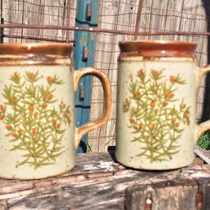 Vintage pair stoneware herb salt and pepper shakers