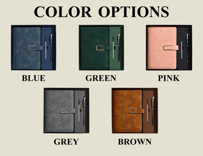 May include: Five sets of notebooks and pens labelled COLOR OPTIONS, BLUE, GREEN, PINK, GREY, and BROWN. Each set includes a rectangular notebook with a gold-toned metal clasp closure and a matching pen, presented in a box with a dedicated pen slot.