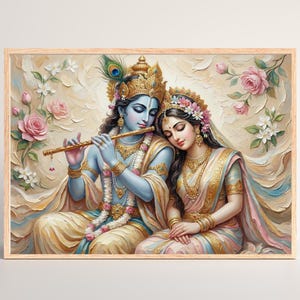 May include: A framed print depicting a serene scene of two figures in traditional attire. One figure, with blue skin, plays a flute. The other, adorned with flowers, rests her head on the first figure's shoulder. Soft colors and floral accents enhance the artwork.