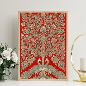May include: Framed artwork featuring a vibrant red background with an intricate gold and navy paisley tree design. Two peacocks stand at the base of the tree. The artwork is in a wooden frame, adding a touch of elegance to the piece.