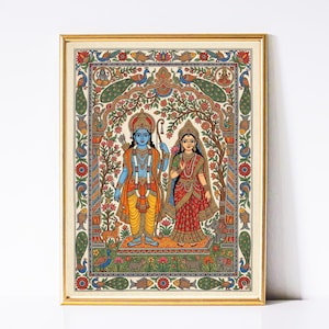 May include: A framed, colourful painting depicting two figures in traditional Indian attire. The figures stand beneath an archway of foliage, surrounded by floral and animal motifs. The artwork features vibrant hues of blue, orange, red, and green, with a gold frame.