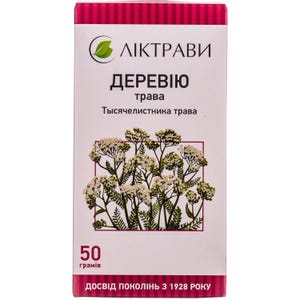 Puede incluir: Una caja rectangular con el texto "ЛІКТРАВИ" y "ДЕРЕВІЮ трава" en letras blancas. La caja presenta una ilustración de flores blancas y hojas verdes. La parte inferior de la caja dice "50 грамів" y "ДОСВІД ПОКОЛІНЬ З 1928 РОКУ".
