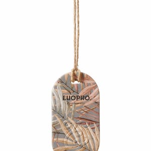 May include: An oval-shaped tag with a gray background and a botanical design in shades of brown and pink. The tag has the word "EUOPHO" and the phrase "ENCOUNTER LOVE" printed on it. A natural twine string is attached.