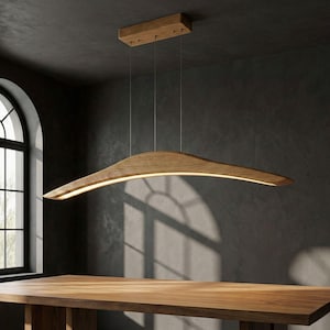 May include: A set of three ceramic mugs with a speckled, matte finish. The mugs are in shades of cream, light brown, and dark brown. Each mug has a simple, minimalist design and a rounded handle.