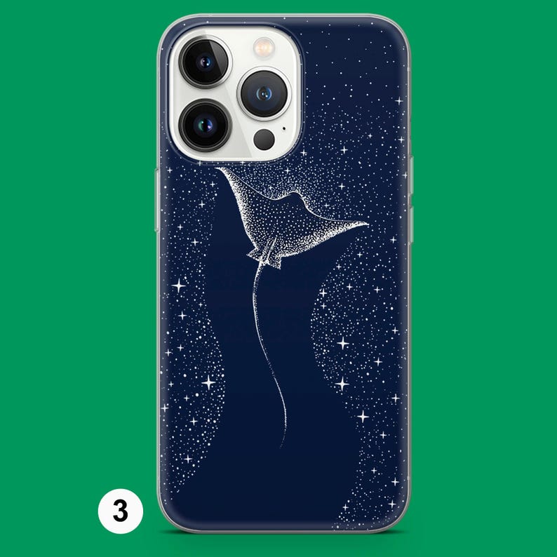 May include: A navy blue phone case with a white stingray design set against a starry night sky. The stingray is detailed with small dots, and the background is filled with white stars. The case has a clear border.