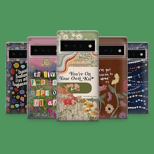 May include: Five phone cases with distinct designs are displayed. One case has a floral pattern and the text "You're On Your Own, Kid." Other cases feature text and graphics, such as gemstones, a sun, and floral arrangements. The background is green.